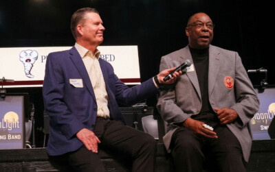 Carlester Crumpler shares some stories as he sits with Jeff Gravley.